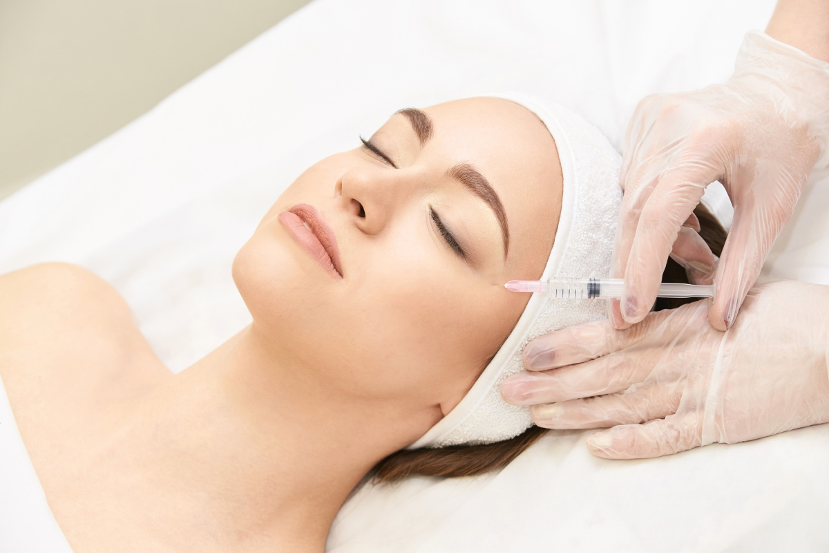 Woman getting Botox-type injectable treatment at a medical spa
