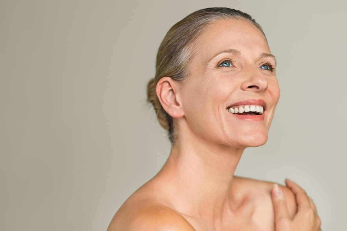 Mature senior woman smiling off camera