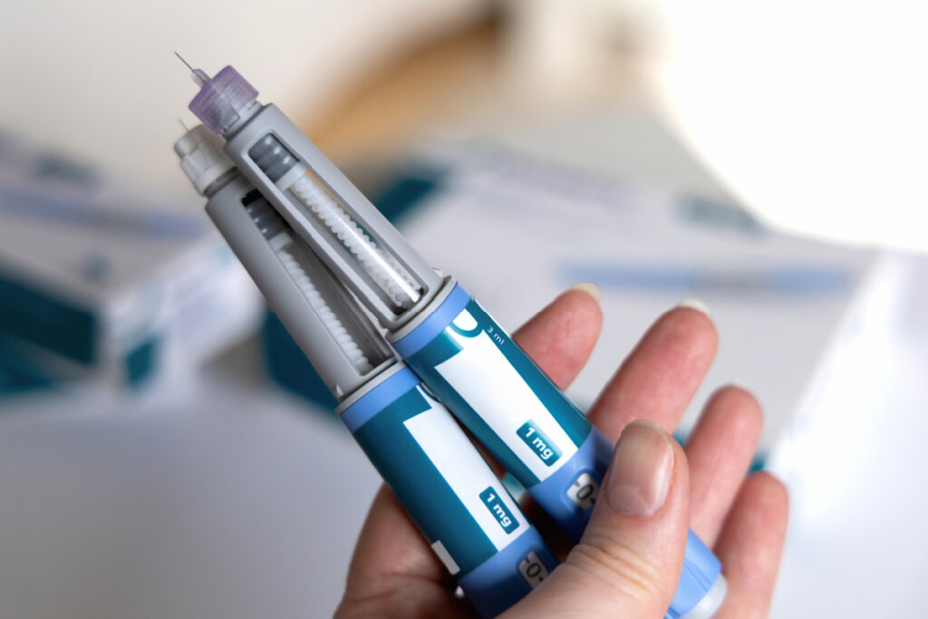 Person holding two semaglutide cartridges 