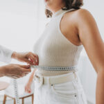 Woman during her weekly weigh in during a medical weight loss program