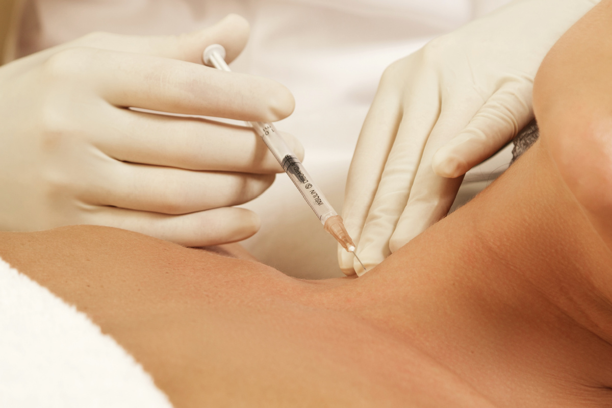 Woman getting Botox in the neck
